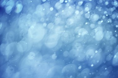 Abstract blurred blue color rain drop bokeh background