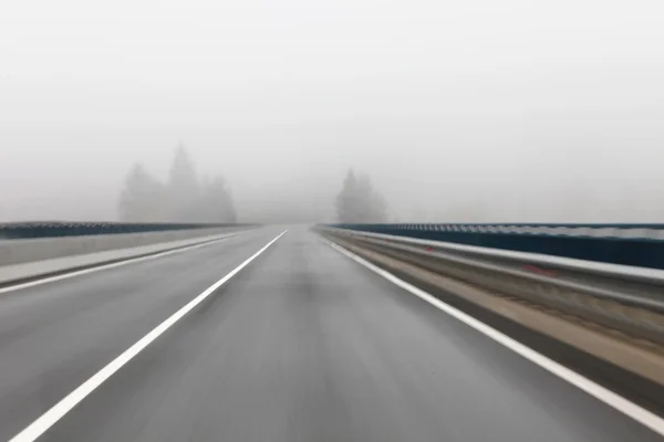 Foggy highway driving — Stock Photo, Image