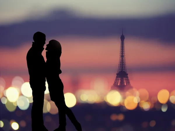 Silhouette of romantic lovers with eiffel tower on a background in Paris Stock Picture