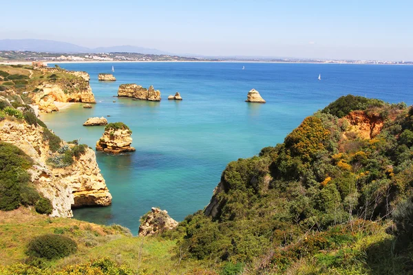 Rocky beach at sunset, Lagos, Portugal. — Stock Photo, Image