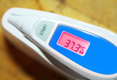 Thermometer with red indicator. Medical concept