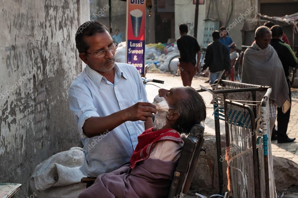 depositphotos_64354983-stock-photo-street-barber-shaving-a-man.jpg