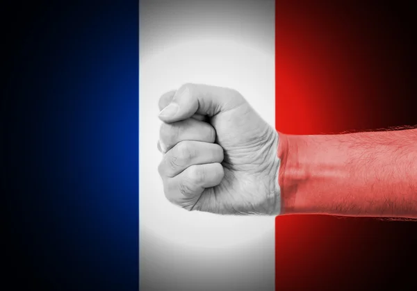 Punho sobre a bandeira da França — Fotografia de Stock