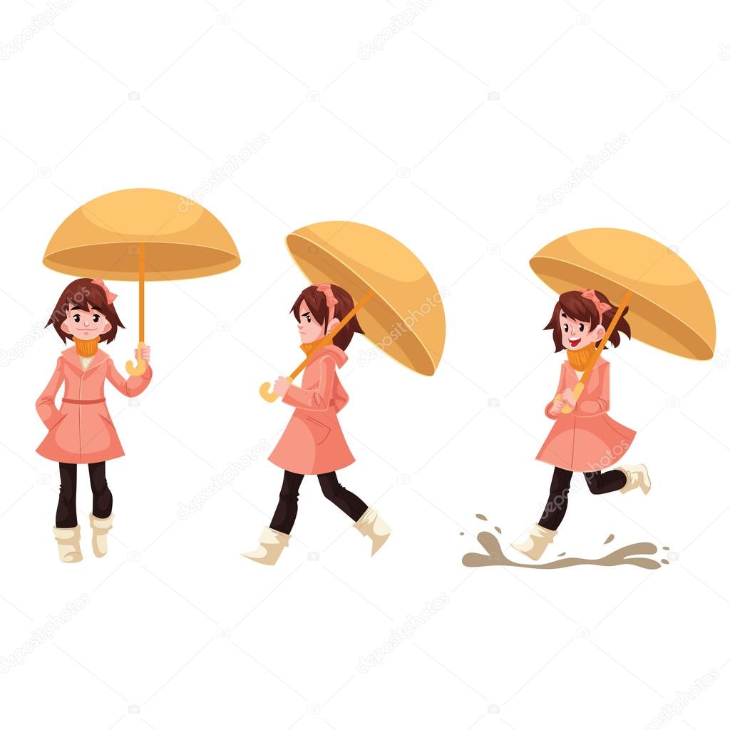 Little girl in a raincoat with umbrella enjoying rainy weather