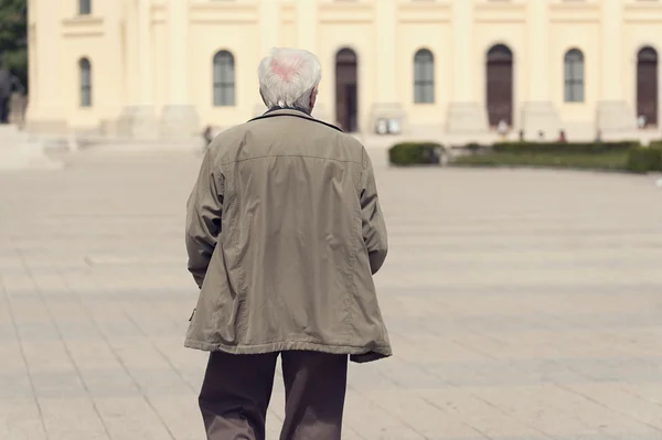 Old man walking in the street