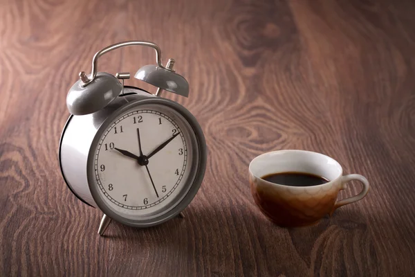 Coffee  and antique clock on wooden — Stock Photo, Image