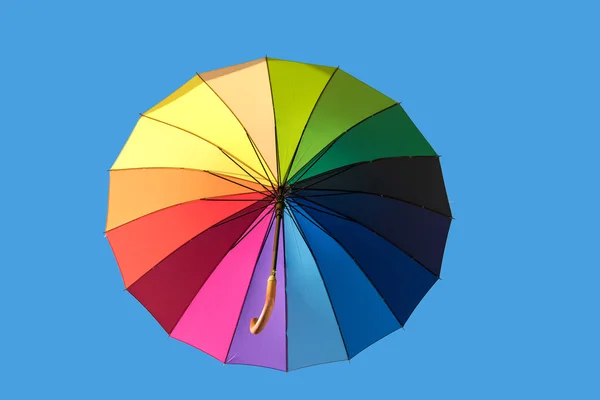 Rainbow umbrella isolated on sky — Stock Photo, Image