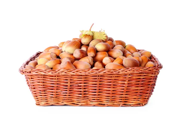 Heap hazelnut in basket isolated on white — Stock Photo, Image