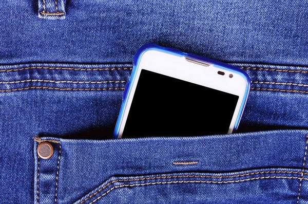 O parte din telefonul mobil în buzunarul blugilor albaștri — Fotografie, imagine de stoc
