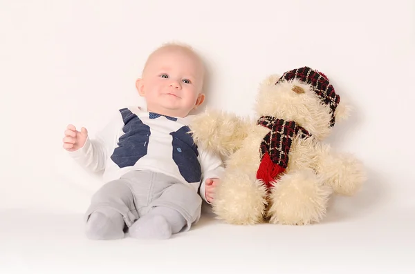 Adorable baby on white background with his friend — Stock Photo, Image