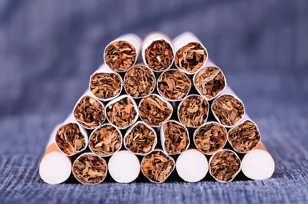 Closeup photo of cigarettes on a jeans background — Stock Photo, Image