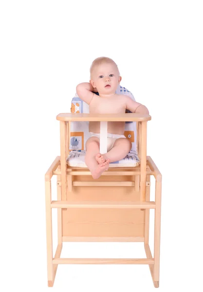 Adorable baby in high chair isolated — Stock Photo, Image