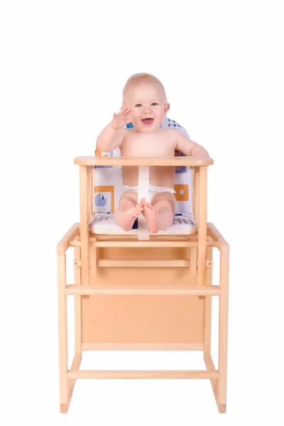 Adorable baby in high chair isolated — Stock Photo, Image