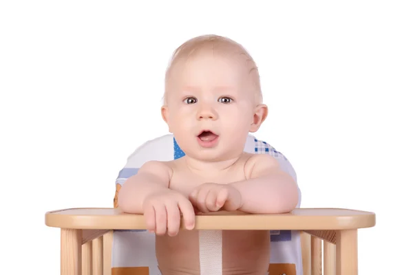 Adorable baby in high chair isolated — Stock Photo, Image