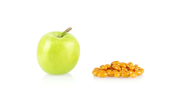 Grönt äpple och medicinska tabletter isolerade — Stockfoto