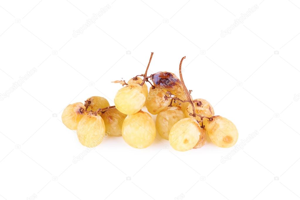 A bunch of overripe grapes isolated on white