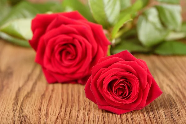 Photo of roses on wooden — Stock Photo, Image
