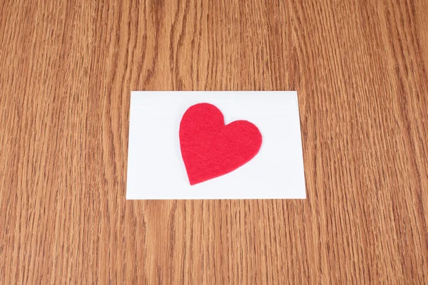 Red heart shape on white envelope — Stock Photo, Image