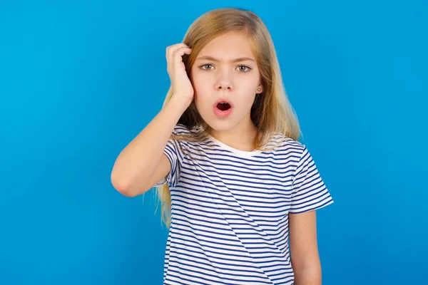 Embarrassed Caucasian Girl Wearing Striped Shirt Blue Wall Shocked Expression — Stock Photo, Image