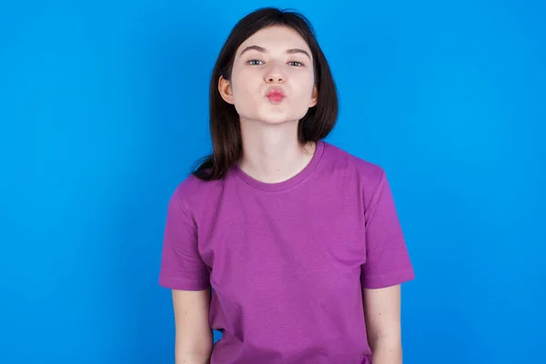 Shot Pleasant Looking Young Woman Pouts Lips Looks Camera Human — Φωτογραφία Αρχείου