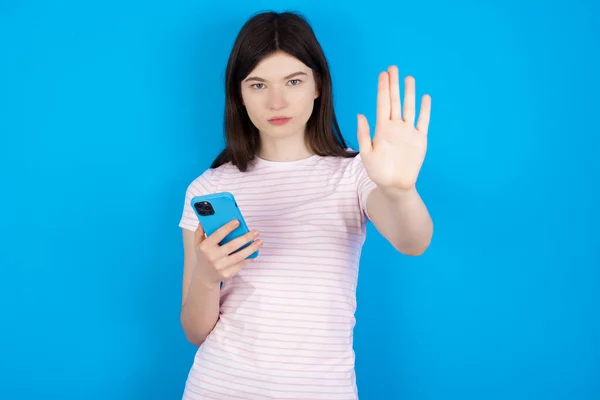 Young Brunette Woman Using Texting Smartphone Open Hand Doing Stop — Stockfoto