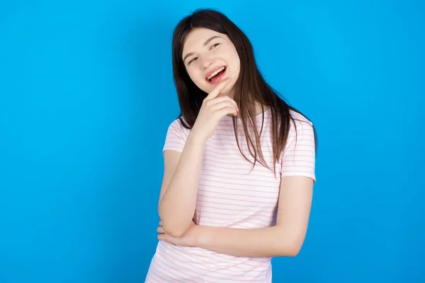 Young Brunette Woman Laughs Happily Keeps Hand Chin Expresses Positive — Stok fotoğraf