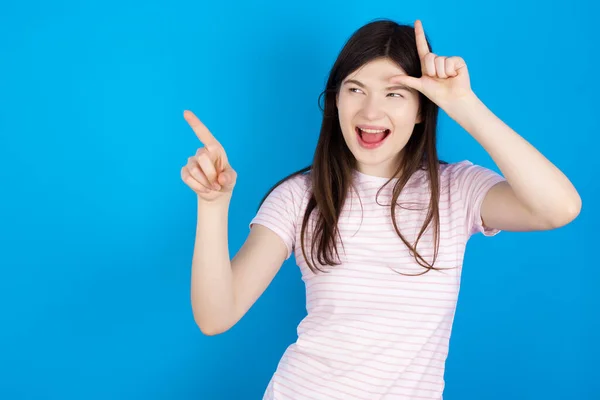 Young Brunette Woman Showing Loser Sign Pointing Empty Space — ストック写真