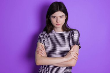 young brunette woman Pointing down with fingers showing advertisement, surprised face and open mouth