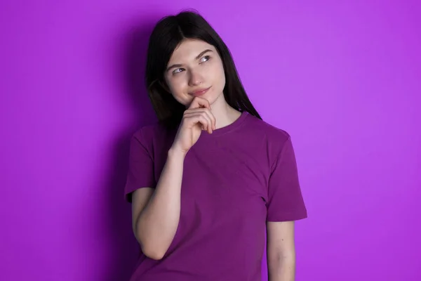 Thoughtful Young Brunette Woman Holds Chin Looks Away Pensively Makes — Stok fotoğraf