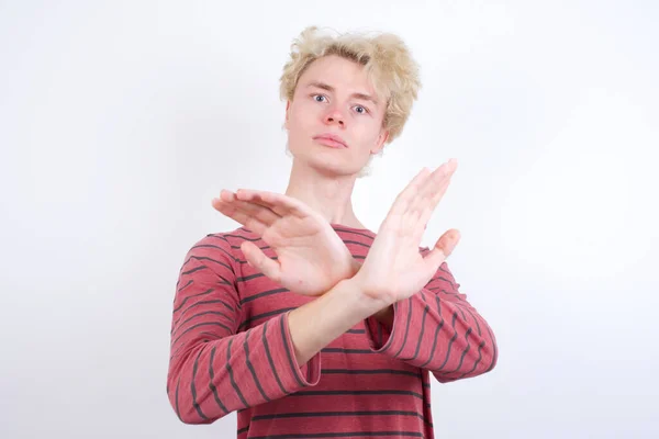 Young Blond Man Has Rejection Expression Crossing Arms Palms Doing — Φωτογραφία Αρχείου