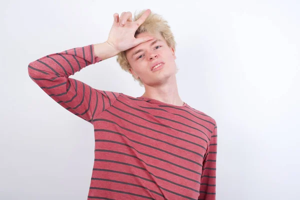 Young Blond Man Making Fun People Fingers Forehead Doing Loser — Stock Photo, Image