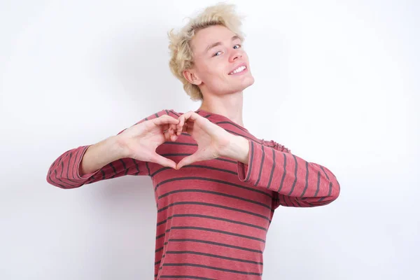 Young Blond Man Smiling Love Doing Heart Symbol Shape Hands — Stock Photo, Image