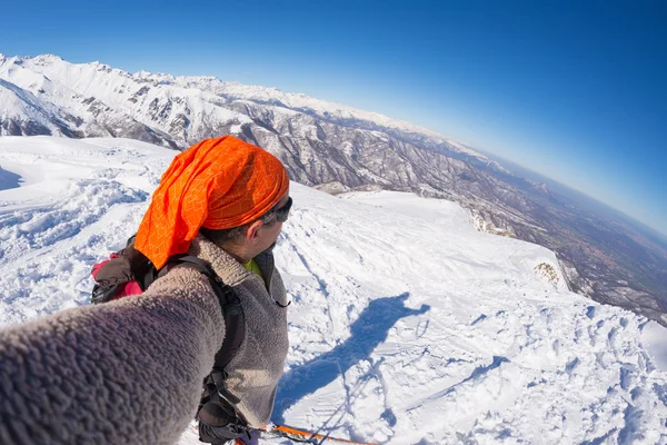 Alpinist taking selfie on snowcapped mountain, fisheye lens — Stock Photo, Image