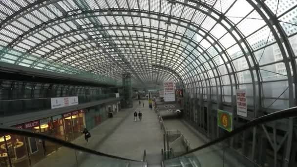 Going down on escalator in Torino Porta Susa train station, Italy. — Stock Video