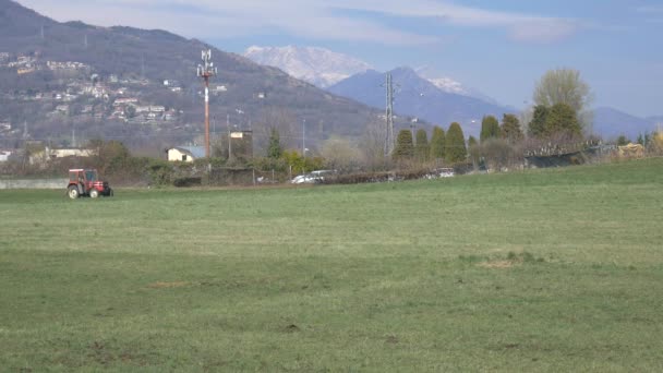 Tractor Working Cultivated Fields Farmland Mountains Agriculture Occupation Lush Green — Stock Video