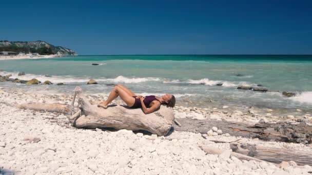 Slow Motion Woman Relaxing White Gravel Beach Turquoise Water Conero — Stock Video