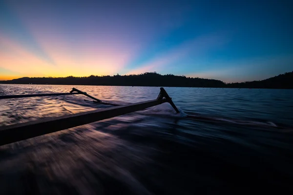 Traditional boat riding at sunset — Stock Photo, Image