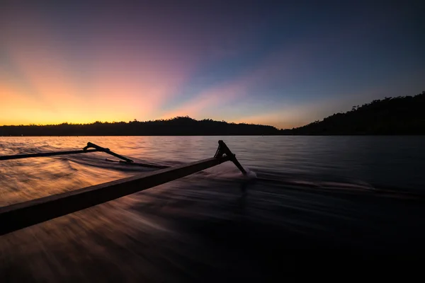 Traditional boat riding at sunset — Stock Photo, Image