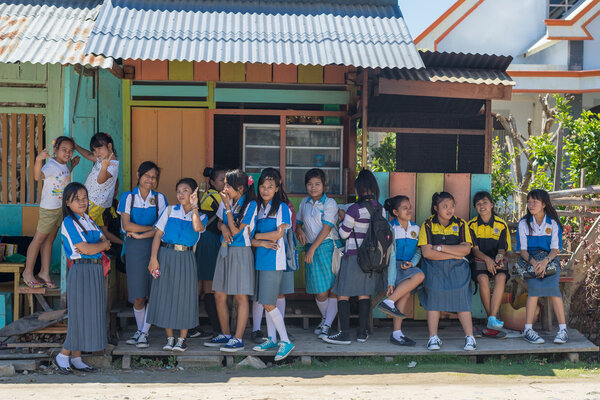 Indonesian school girls waiting outdoors