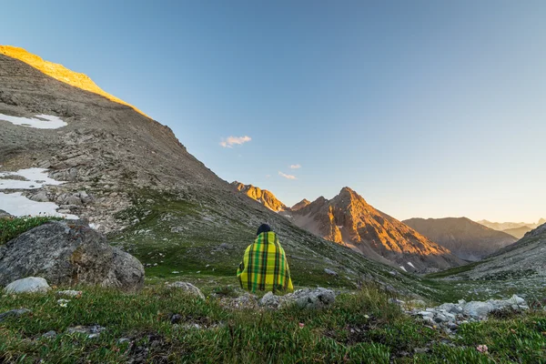 One person watching sunset in the Alps — Stock Photo, Image
