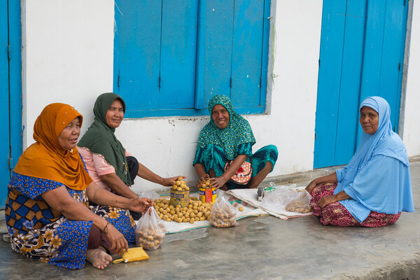 Group of women selling tropical fruit