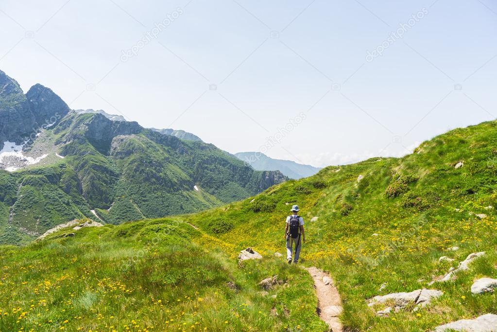 Hiking in the Alps on panoramic footpath