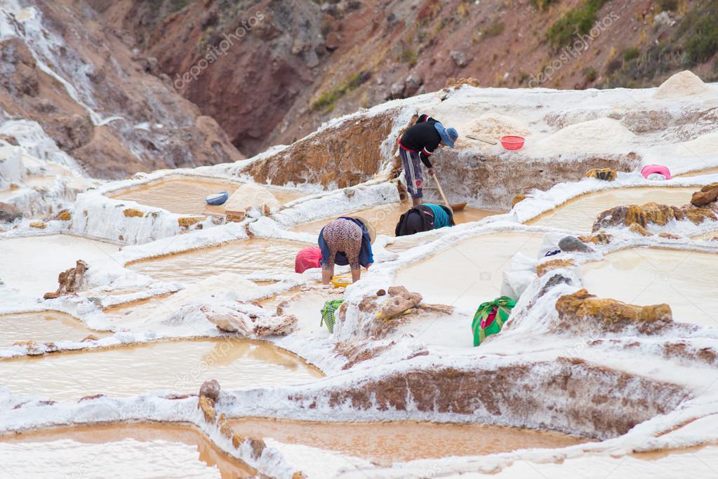 Workers in salt basins on the Peruvian Andes