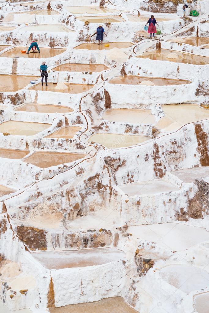 Workers in salt basins on the Peruvian Andes