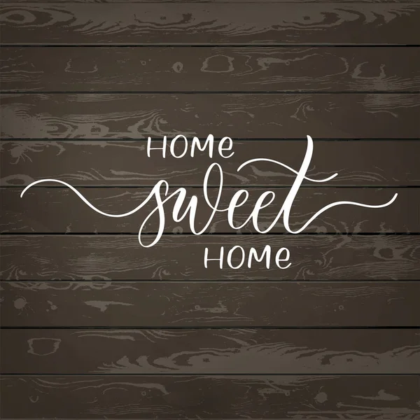 Home sweet home - handgeschriebene Inschrift auf Holz-Hintergrund. — Stockvektor