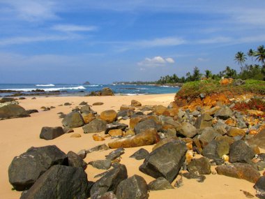 Sunny beach with rocks, Sri-Lanka