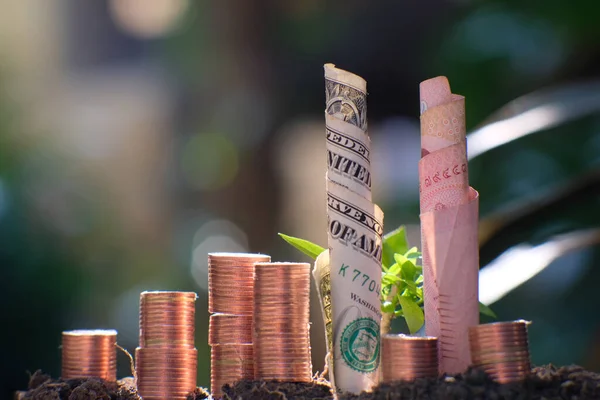 stacks of gold money coin on black background and concept saving money, business growth strategy of money concept, advertising coins of finance and banking