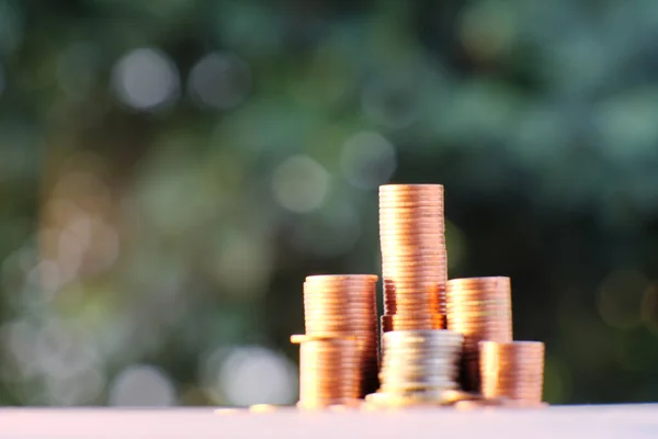 Stacks of gold money coin on black background and concept saving money, business growth strategy of money concept, advertising coins of finance and banking