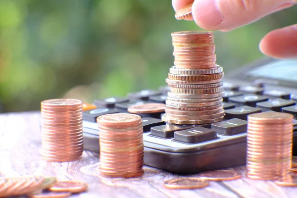 Stacks of gold money coin on table background and concept saving money, business growth strategy of money concept, advertising coins of finance and banking