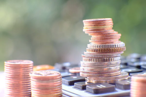 Stacks of gold money coin on table background and concept saving money, business growth strategy of money concept, advertising coins of finance and banking